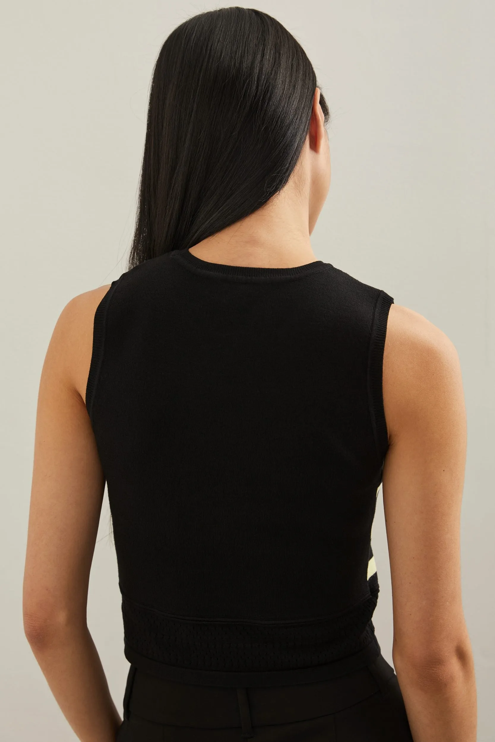 Cropped sleeveless sweater with pointelle detail